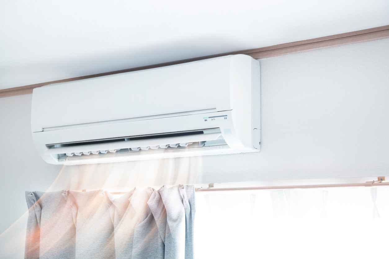 Mini split air conditioner blowing air.