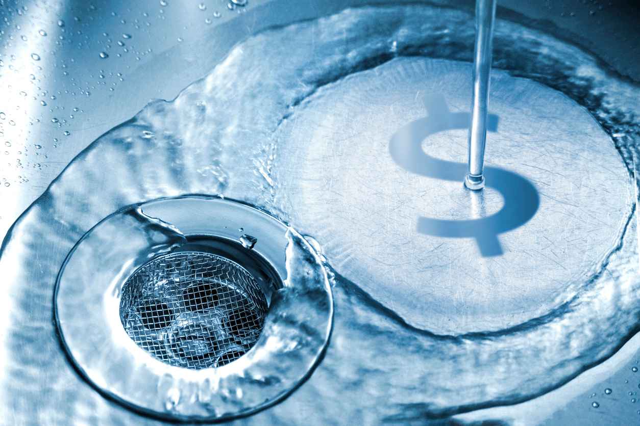 water flowing down the sink drain with a dollar sign showing