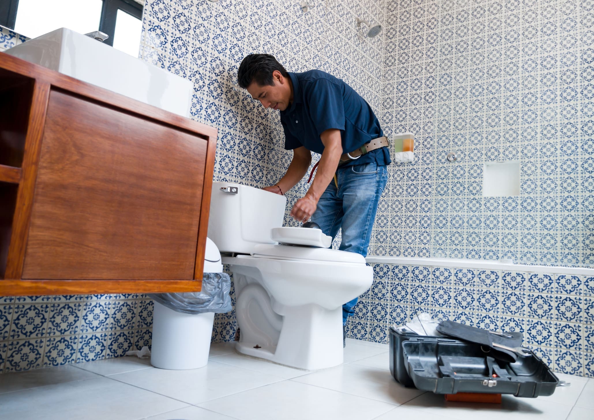 Plumber Fixing Toilet