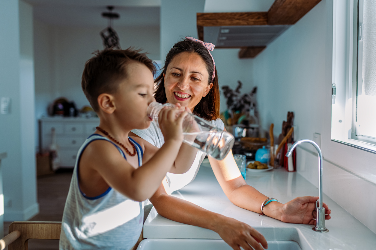 Family Using Water Filtration System