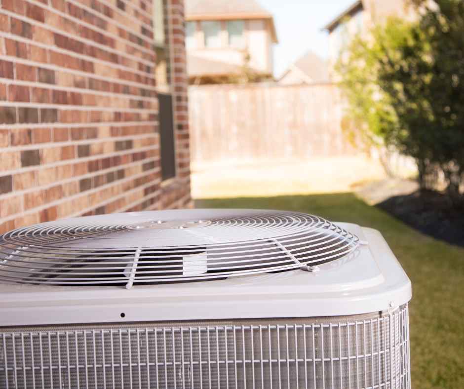 An air conditioning unit on the outside of a home